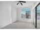 Bedroom featuring large window with privacy blinds, mirrored closet doors, and neutral carpet at 7270 W Tina Ln, Glendale, AZ 85310