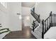 Welcoming home entryway featuring wood floors and staircase at 7270 W Tina Ln, Glendale, AZ 85310