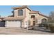 Charming two-story home with a tile roof, arched entry, and well-maintained landscaping at 7270 W Tina Ln, Glendale, AZ 85310