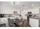 Bright kitchen with white cabinets, granite counters, stainless steel appliances, and a cozy breakfast nook at 7270 W Tina Ln, Glendale, AZ 85310