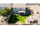 Aerial shot of a landscaped backyard with lush green grass and a charming gazebo at 7703 S 68Th Dr, Laveen, AZ 85339