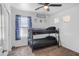 Cozy bedroom featuring a bunk bed, plush carpeting, and neutral walls offering a comfortable space at 7703 S 68Th Dr, Laveen, AZ 85339