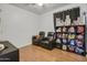 Cozy bedroom with dual leather recliners and a display shelf at 7703 S 68Th Dr, Laveen, AZ 85339