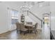 Dining area featuring an elegant light fixture and access to the backyard at 7703 S 68Th Dr, Laveen, AZ 85339