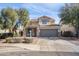 Charming two-story home with meticulously landscaped front yard at 7703 S 68Th Dr, Laveen, AZ 85339