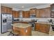 Spacious kitchen featuring stainless steel appliances and granite countertops at 7703 S 68Th Dr, Laveen, AZ 85339