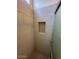 Tiled shower with a built-in niche and penny tile floor at 7728 W Via Montoya Dr, Peoria, AZ 85383