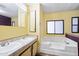 Bright bathroom with double sinks and separate tub at 8103 E Southern Ave # 25, Mesa, AZ 85209