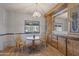 Bright dining area featuring hardwood floors and a charming chandelier at 8103 E Southern Ave # 25, Mesa, AZ 85209