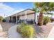 Exterior view of a home showing an expansive covered patio at 8103 E Southern Ave # 25, Mesa, AZ 85209