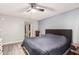 Comfortable bedroom with ceiling fan and a closet at 8231 N 21St Dr # E101, Phoenix, AZ 85021