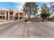 Gated entrance to the community featuring well-maintained landscaping and secure access at 8231 N 21St Dr # E101, Phoenix, AZ 85021