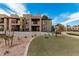 Exterior view of a multi-story building with balconies and a playground in the background at 8231 N 21St Dr # E101, Phoenix, AZ 85021