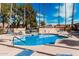 Community pool with sun loungers, tables, and well-maintained landscaping around the pool area at 8231 N 21St Dr # E101, Phoenix, AZ 85021