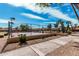 Community tennis court featuring well-maintained court surface, sturdy fencing, and manicured landscaping at 8231 N 21St Dr # E101, Phoenix, AZ 85021