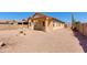 Exterior of home with patio, desert landscaping, cactus and privacy wall at 8250 S Hidden Trail Ct, Gold Canyon, AZ 85118