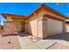 Charming single-story home featuring stone accents, a two-car garage, and a well-maintained front yard at 8250 S Hidden Trail Ct, Gold Canyon, AZ 85118