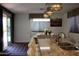 Bright dining area with granite countertops, modern lighting, and a view of the outdoors at 8420 S 40Th Dr, Laveen, AZ 85339