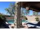 Covered patio with a hammock overlooking a private pool, creating a peaceful outdoor space at 8420 S 40Th Dr, Laveen, AZ 85339