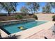 Backyard swimming pool with a water feature in a desert landscape at 8420 S 40Th Dr, Laveen, AZ 85339