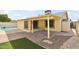 Exterior view of the covered back patio and swimming pool in the backyard at 8562 W Windsor Blvd, Glendale, AZ 85305