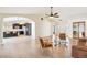 Spacious living room with hardwood floors, an archway into the kitchen, and stylish furnishings at 8562 W Windsor Blvd, Glendale, AZ 85305