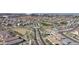 Scenic aerial view of a community with a roundabout and desert landscaping at 9008 W Bethany Heights Dr, Glendale, AZ 85305