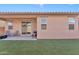 Exterior view of patio and backyard with low maintenance synthetic grass at 9008 W Bethany Heights Dr, Glendale, AZ 85305