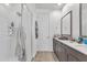 Modern bathroom with a glass-enclosed shower, a gray vanity, and stylish fixtures at 9008 W Bethany Heights Dr, Glendale, AZ 85305