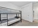 Cozy bedroom featuring a bunk bed and white sliding closet doors at 9008 W Bethany Heights Dr, Glendale, AZ 85305