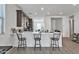 Bright kitchen featuring a spacious quartz countertop island with bar stool seating at 9008 W Bethany Heights Dr, Glendale, AZ 85305