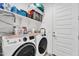 Efficient laundry room with front load washer and dryer with plenty of storage at 9008 W Bethany Heights Dr, Glendale, AZ 85305