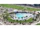 Aerial view of a community pool area with palm trees and ample seating at 9008 W Bethany Heights Dr, Glendale, AZ 85305