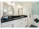 Elegant bathroom featuring dual mirrors, sleek countertops, white cabinets, modern lighting, and a tiled walk-in shower at 9340 E Sun Lakes S Blvd, Sun Lakes, AZ 85248