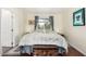 Serene bedroom with wood floors, a chest at the foot of the bed, and ample natural light from a bright window at 9340 E Sun Lakes S Blvd, Sun Lakes, AZ 85248