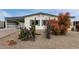 Single-story home featuring low maintenance landscaping and desert foliage at 9340 E Sun Lakes S Blvd, Sun Lakes, AZ 85248