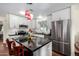 Modern kitchen with stainless steel appliances, black countertops, and ample cabinet space at 9340 E Sun Lakes S Blvd, Sun Lakes, AZ 85248