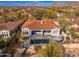 Stunning aerial view of a private backyard with pool, manicured landscaping, and outdoor entertaining space at 9565 E Mountain Spring Rd, Scottsdale, AZ 85255