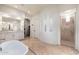 Spacious bathroom featuring double sink vanity, soaking tub and walk in shower at 9565 E Mountain Spring Rd, Scottsdale, AZ 85255