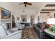 Cozy living room featuring a fireplace, armchairs, and a comfortable leather sofa at 9565 E Mountain Spring Rd, Scottsdale, AZ 85255