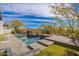 Beautiful pool area with desert landscaping, seating area, and mountain views in a serene backyard setting at 9565 E Mountain Spring Rd, Scottsdale, AZ 85255