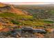 Expansive luxury home with desert landscaping and golf course views, set against a mountain backdrop at 9820 E Thompson Peak Pkwy # 629, Scottsdale, AZ 85255