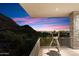 Balcony with telescope features striking sunset views of city and mountains at 9820 E Thompson Peak Pkwy # 629, Scottsdale, AZ 85255