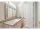 This bathroom features a granite countertop and a decorative framed mirror at 9820 E Thompson Peak Pkwy # 629, Scottsdale, AZ 85255