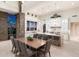 Open-concept dining area with a modern table, chairs, and gourmet kitchen view at 9820 E Thompson Peak Pkwy # 629, Scottsdale, AZ 85255