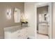 Hallway with granite countertop, stylish sconces, mirror and decorative flowers at 9820 E Thompson Peak Pkwy # 629, Scottsdale, AZ 85255