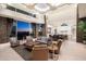 Open-concept living area featuring soaring ceilings, stone accents, comfortable seating, and scenic views at 9820 E Thompson Peak Pkwy # 629, Scottsdale, AZ 85255