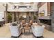 Stunning living room featuring a stone wall, fireplace, and large glass doors leading to outdoor vistas at 9820 E Thompson Peak Pkwy # 629, Scottsdale, AZ 85255