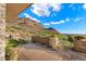 Outdoor patio overlooking golf course with mountain views and desert landscaping at 9820 E Thompson Peak Pkwy # 629, Scottsdale, AZ 85255