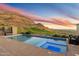 Inviting pool and spa with stunning mountain and golf course views at sunset at 9820 E Thompson Peak Pkwy # 629, Scottsdale, AZ 85255